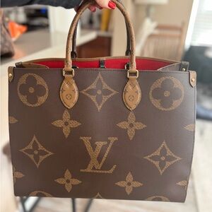 Louis Vuitton Brown Monogram Handbag with Red Interior